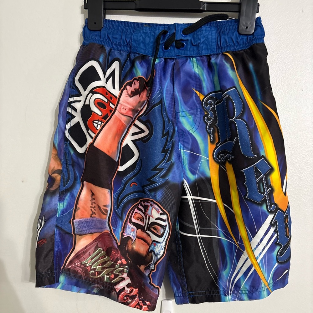 WWE Rey  Mysterio Blue and Black Board Shorts with Wrestling Graphics Size 8